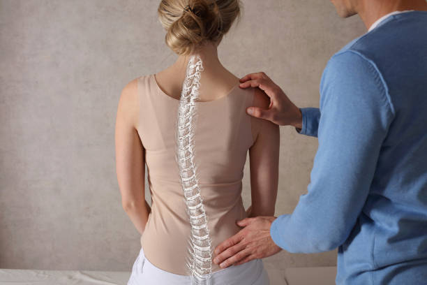 Is scoliosis considered a disease or a disability?